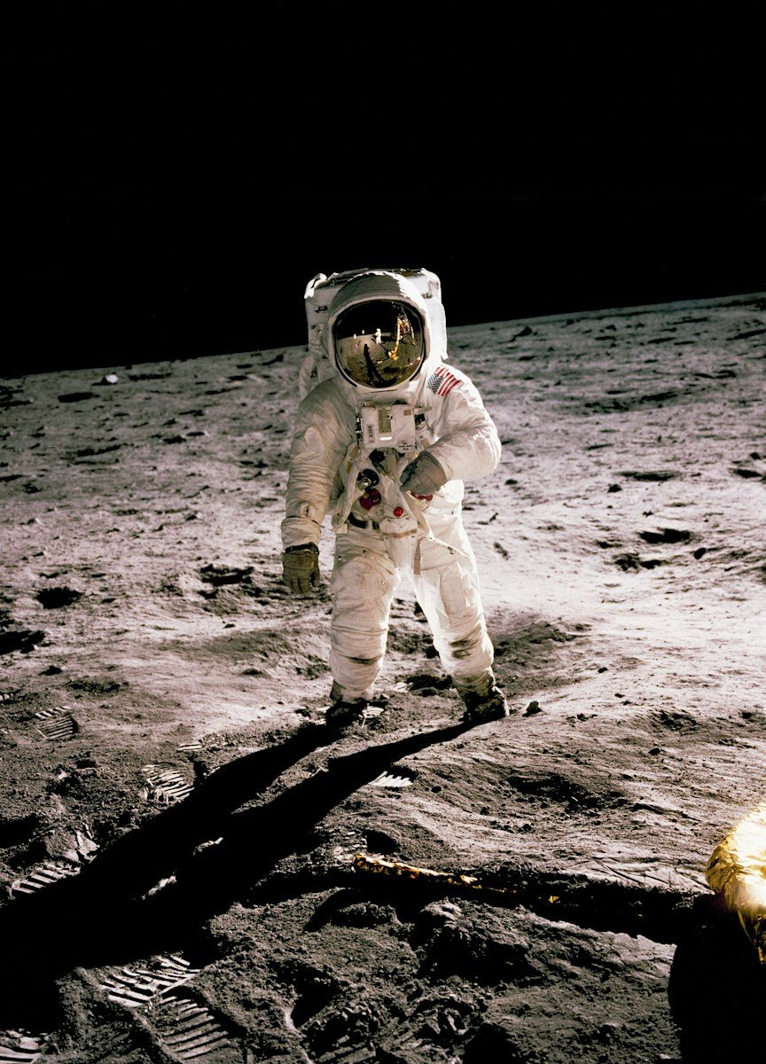 astronaut standing on the moon